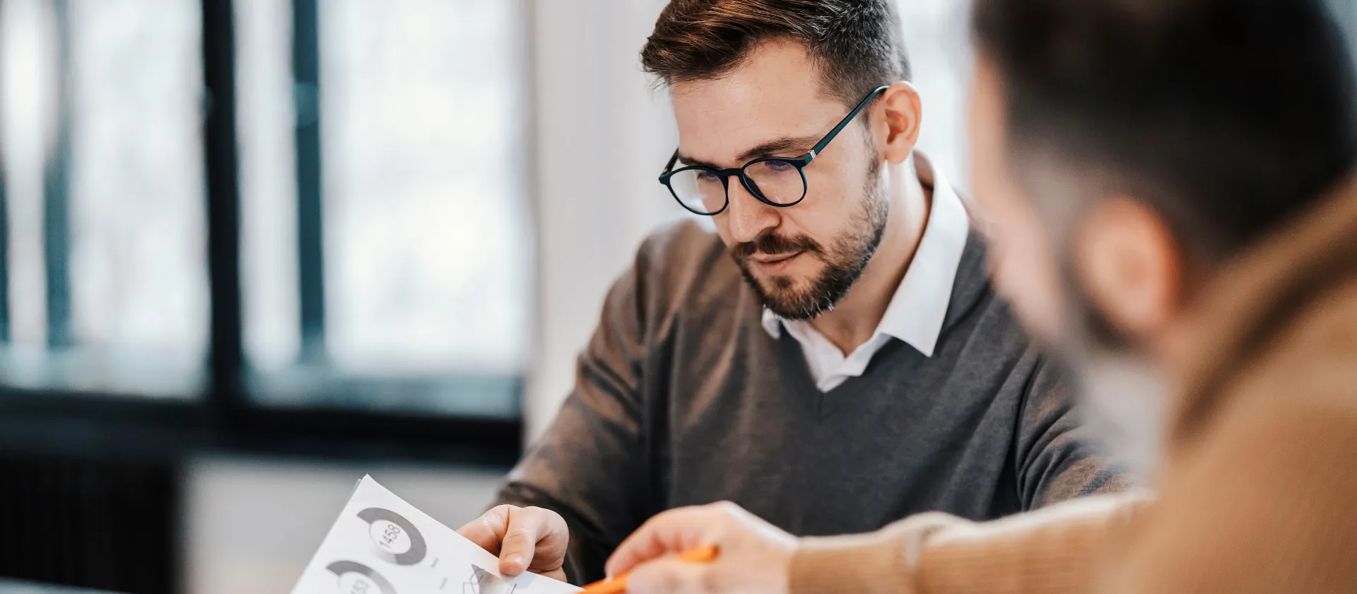 Strategy and Business Meeting: Chart and Statistics—Two Men