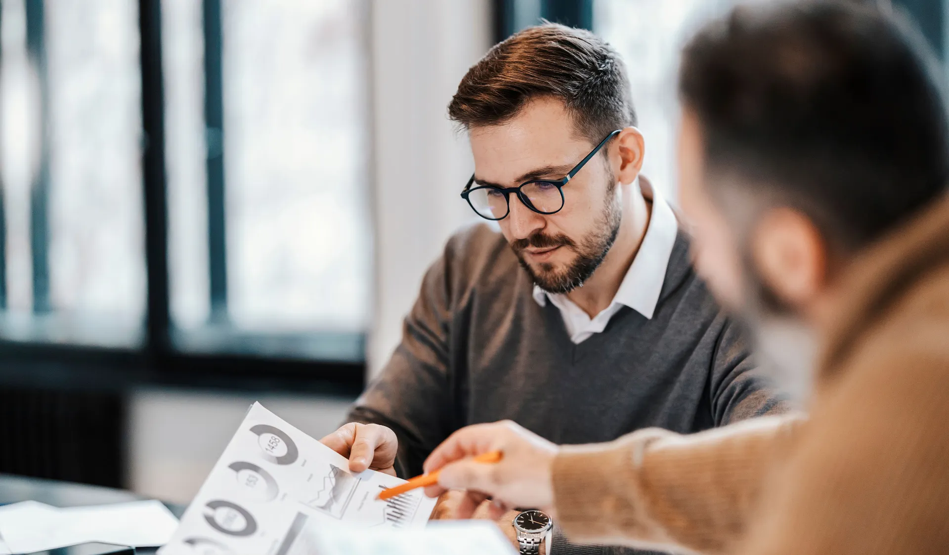 Strategy and Business Meeting: Chart and Statistics—Two Men